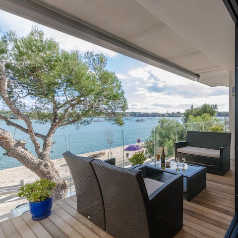 Take in views of the marina and Mediterranean Sea while you sip a glass of wine on the private balcony