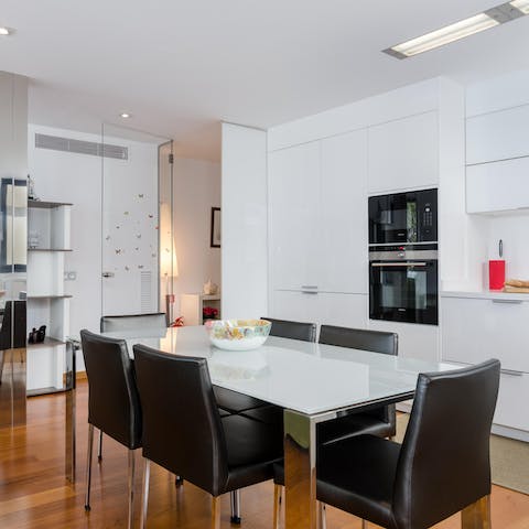 Gather together for a celebratory Spanish feast at the sleek kitchen's table