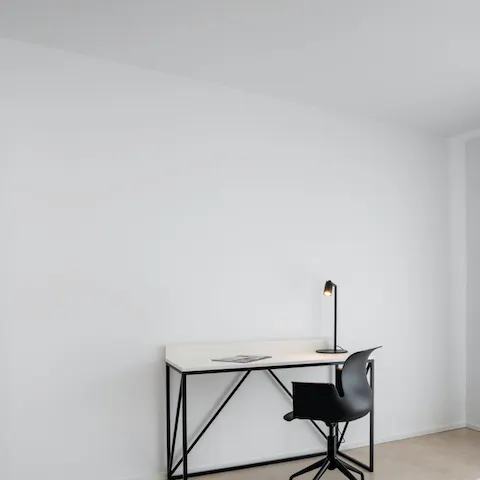 Hit send on those last few emails from your sleek and minimal desk space