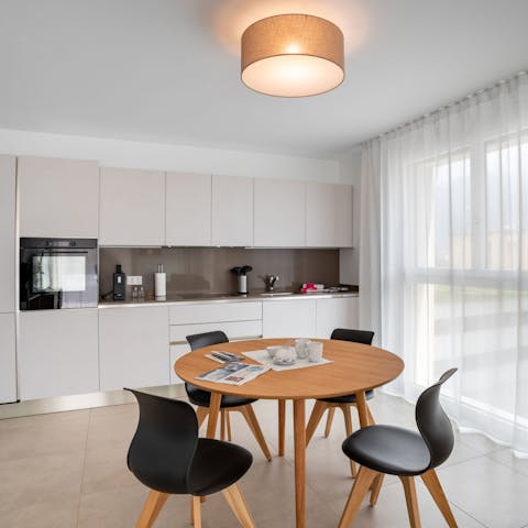 Enjoy leisurely meals together around the mid-century-style dining table