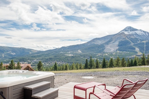 Soak in the hot tub with Lone Peak rising ahead