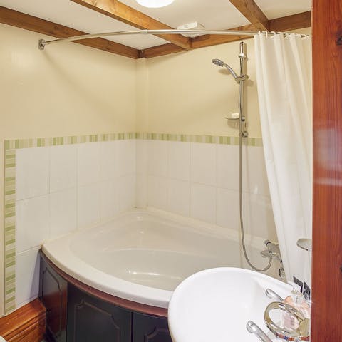 Treat yourself to a long and indulgent session in the corner bathtub