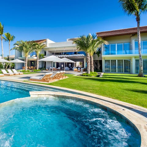 Relax in the jacuzzi with a glass of rum