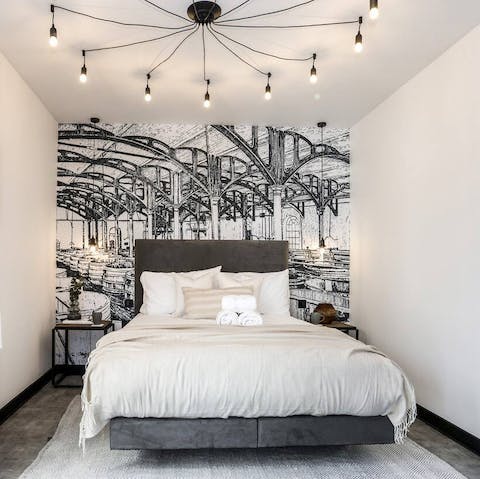 Admire the wall art before falling asleep in the velvet bed