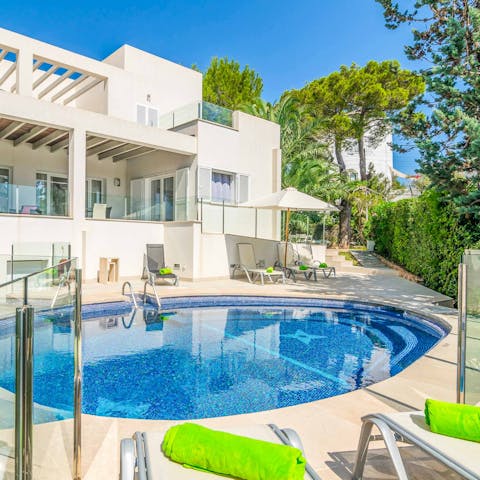 Lay out on a sun lounger by the lagoon-style private pool