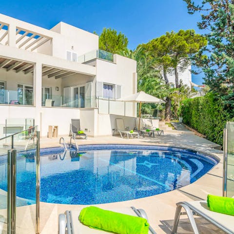 Lay out on a sun lounger by the lagoon-style private pool