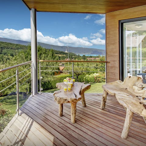 Take in the views over Lake Annecy from the balcony