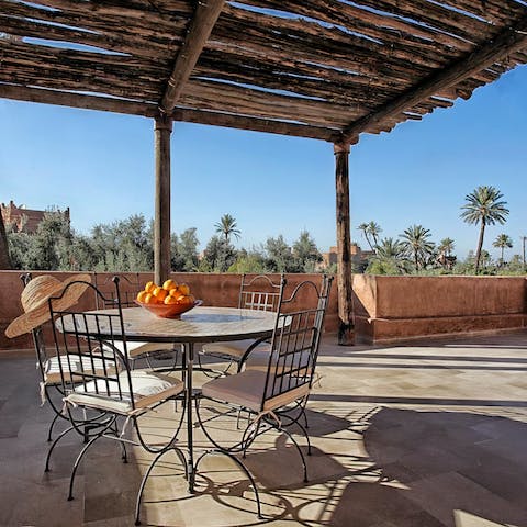 Toast the day's end from the magnificent rooftop terrace