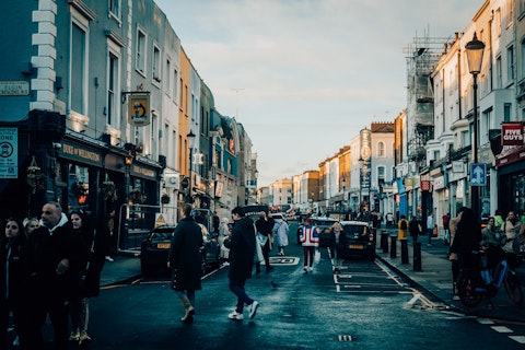 Explore Portobello Road Market, London's legendary antiques and street food market, steps away