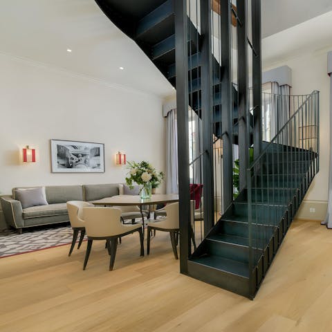 Ascend the steel staircase to the opulent bedrooms