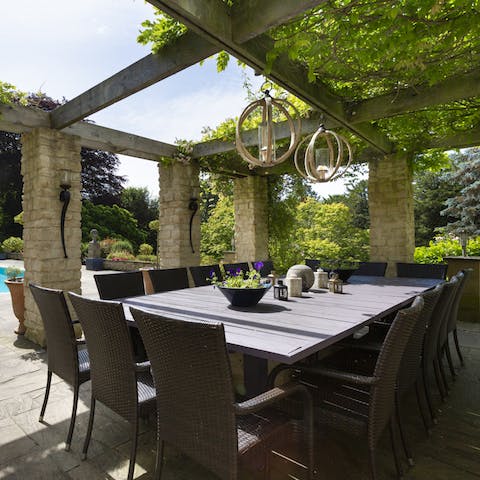 Enjoy an alfresco, Full English breakfast under the vine-covered pergola