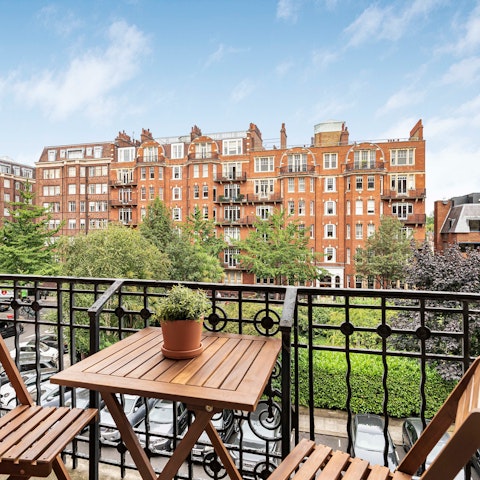 Enjoy morning coffee or an evening cocktail on the private balcony