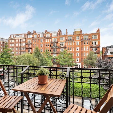 Enjoy morning coffee or an evening cocktail on the private balcony