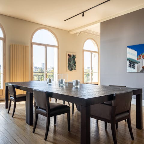 Dine in style in front of the large arched windows