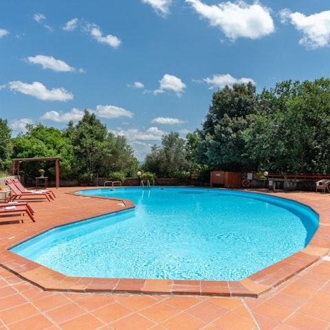 Bask in the Tuscan sun around the private seasonal pool