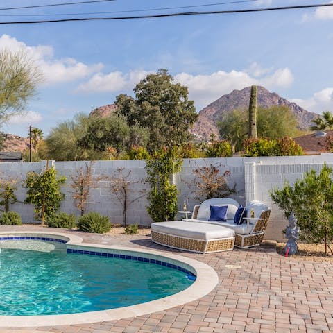 Take a dip in the swimming pool with views of Camelback Mountain