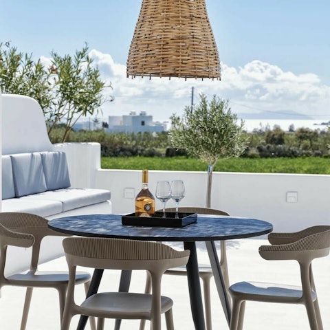 Sit down at the alfresco dining table with breakfast and a good book
