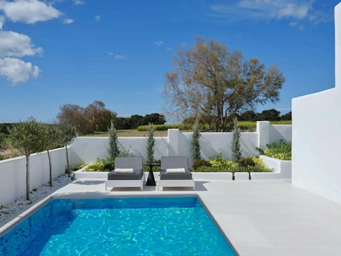 Enjoy a dip in the pool before whiling away the hours on a lounger
