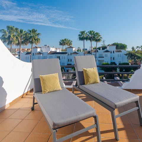 Bask in the sun on the roof terrace with a glass of tinto de verano