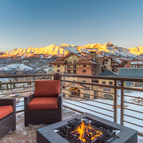 Watch the sunset over the mountain around the firepit