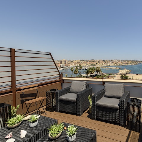 Gather on the terrace and watch the coastal sunsets