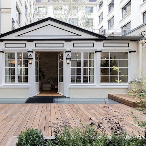 Open up the doors onto the private courtyard