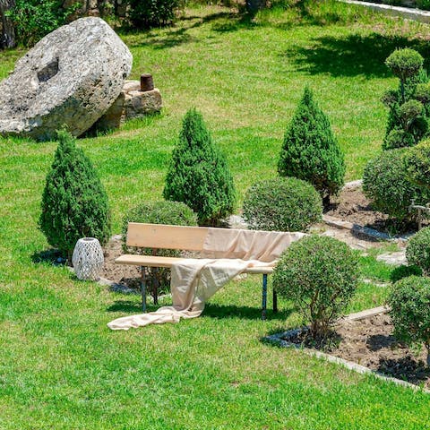 Start the day with a cup of coffee in the manicured garden