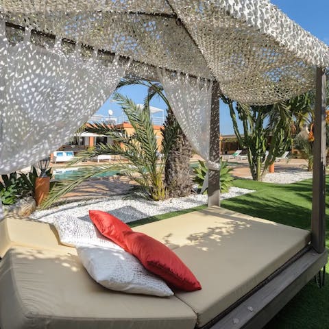 Chill out on a daybed or sip cocktails at the alfresco bar