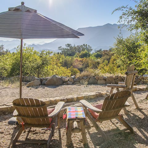 Gaze over the mountains with a cool drink in hand