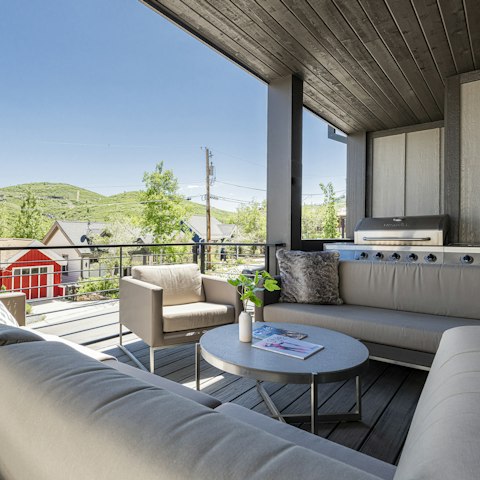 Unwind with drinks and mountain views on the deck