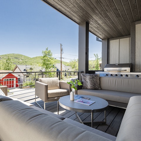 Unwind with drinks and mountain views on the deck