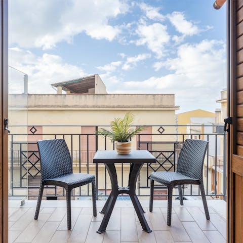 Sip afternoon aperitivos on the private balcony