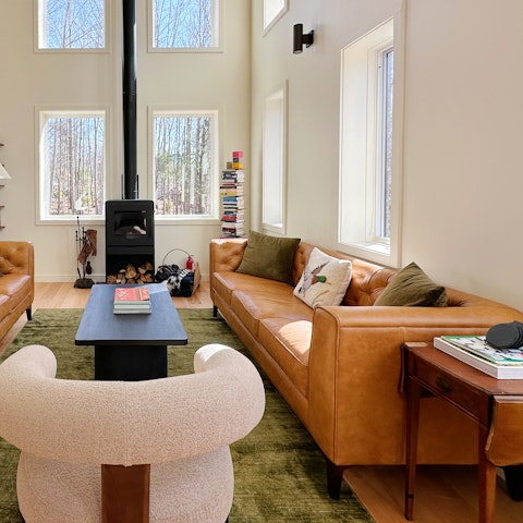 Curl up beside the fire to soak in the woodland views