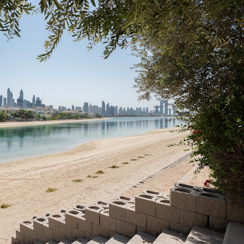 Settle in for a day of sunbathing on the private beach