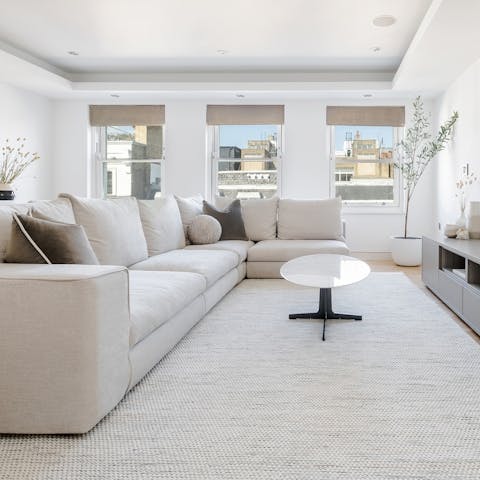 Take in the rooftop views from the light-filled living area