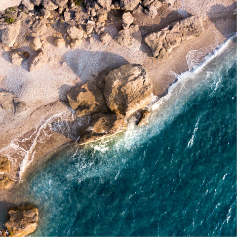 Go for a swim at Paralia Afantou, a short walk from home