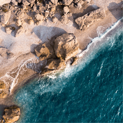 Go for a swim at Paralia Afantou, a short walk from home