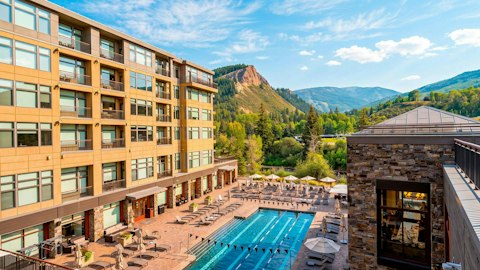 Swim laps beneath the mountains in the shared pool