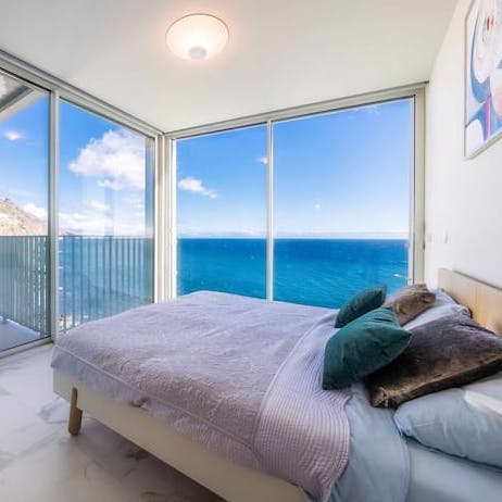 Wake up in the stylish bedrooms to an infinity of blue each morning