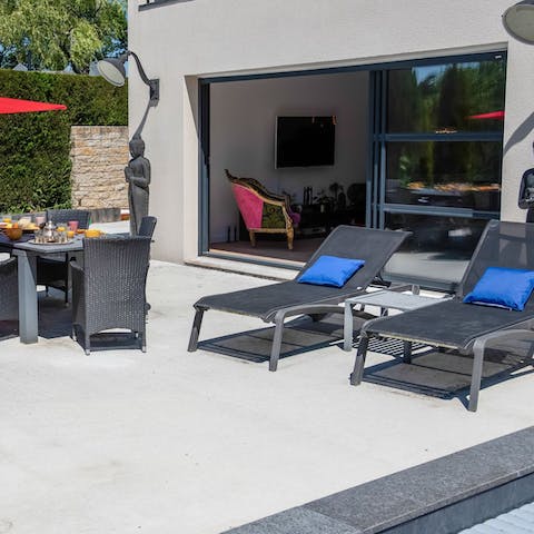 Settle back with your holiday read on a sun lounger