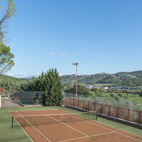 Challenge a family member to a game of tennis