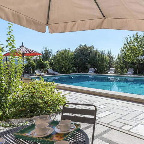 Hide away in the shade between dips in the pool