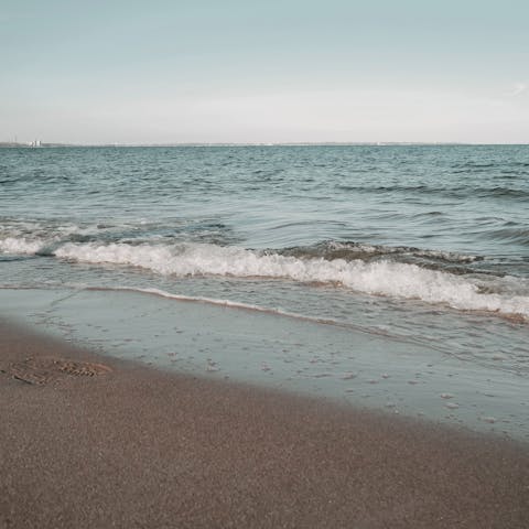 Wander the sands of Koukla Beach – just a seven-minute drive away