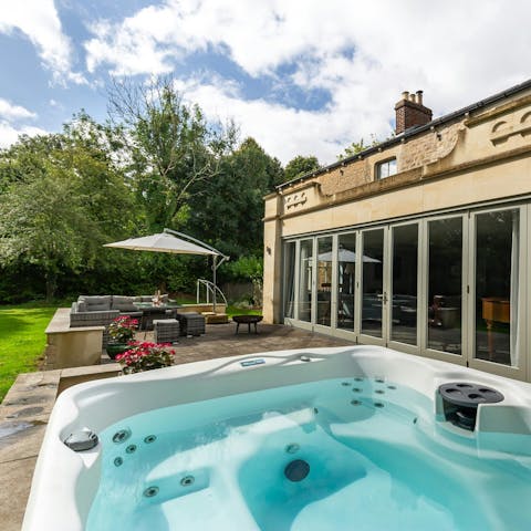 Sip bubbles in the hot tub as the sun warms your skin