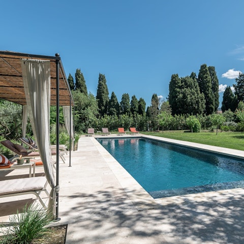 Stretch out by the crystal-clear swimming pool