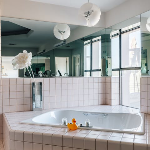 Unwind in the luxurious whirlpool bath in the master bathroom