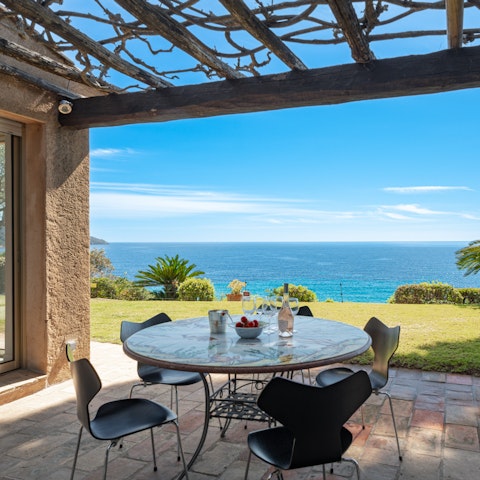 Enjoy views of the Mediterranean Sea from the alfresco dining terrace