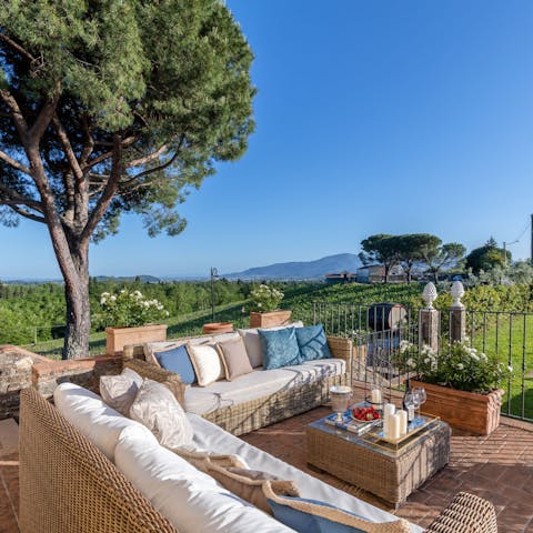 Lap up the stunning views of the surrounding landscapes from the  patio lounge area