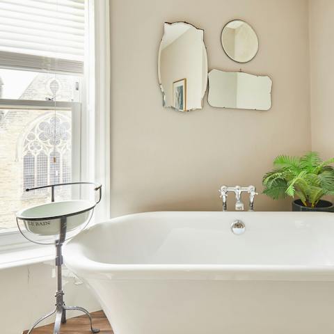 Sneak away for an early evening soak with a glass of something chilled