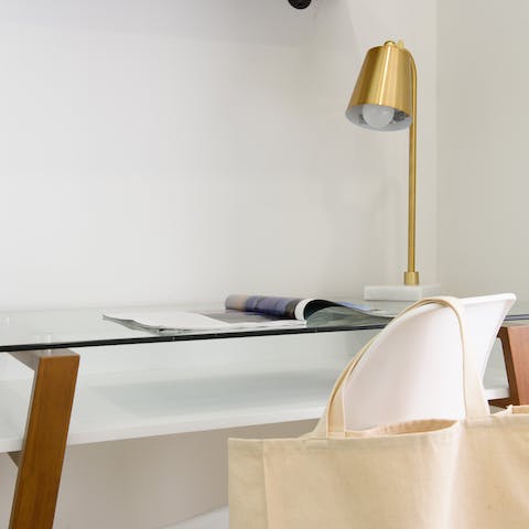 Get some work done at the chic desk in the bedroom